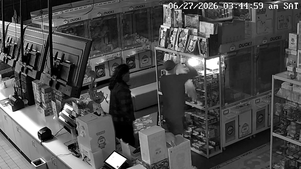 Damaged storefront of DUCK! Entertainment in Eagan after a burglary.